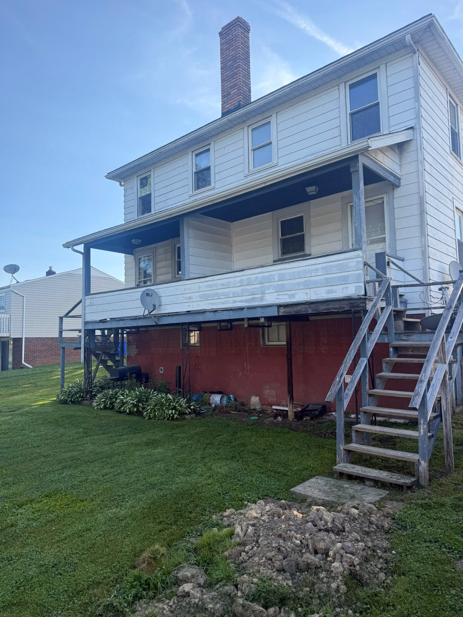 Existing rear porch and stairs before replacement
